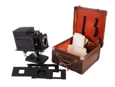 An early 20th Century Optiscope lantern together with a collection of slides.