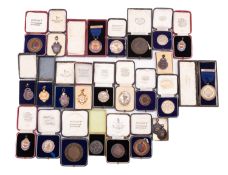 Eight 1930s silver prize medals for Baking to Loius Christens.