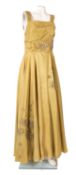 A 'Roecliff and Chapman' mustard evening dress, with pleated shoulder straps,