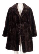 A group of three coats, including a 'Windsmoor' faux fur coat with another,