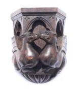 A 20th Century carved oak wall bracket.