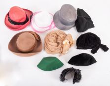 A large group of various lady's hats, including felt skull caps, sun hats, and fascinators.