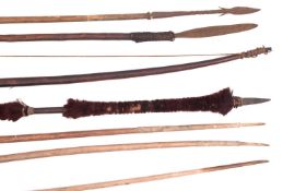 A group of four various tribal bows,