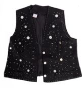 A collection of various dressing up clothes, including trousers, tops, capes etc.