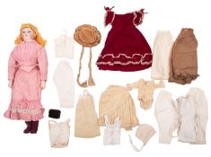 A late 19th Century Continental bisque head doll.