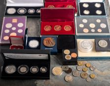 A mixed collection of coins, including two Britannia sets 2007 and 2008, 2001 USA proof dollar,