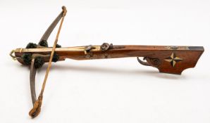 A 19th Century Continental walnut and bone inlaid crossbow.