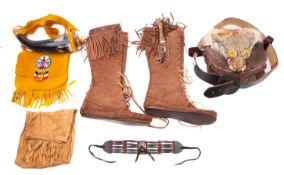 A taxidermy handbag with beaded leather strap.