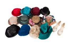 A large group of lady's hats, including various felt hats, a fur hat, occasion hats,