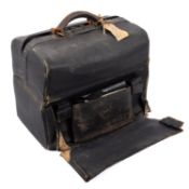 A late Victorian black leather Gladstone bag of traditional form, circa 1890,
