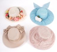 A group of four lady's hats, including a 'Kangol' beige hat with bow ribbon,