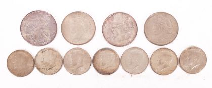 Two USA 1922 dollars. Together with another 1999 USA Dollar and seven 1964 Kennedy half Dollars.