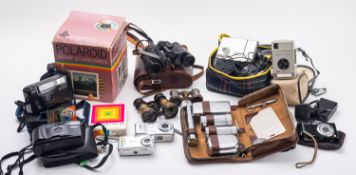 A Polaroid Instant 20 camera with film in original box.