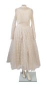 Two 1950/60's wedding style lace dresses, one mid-length with large bow detail to the back,