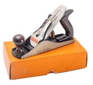 A Stanley No.4 plane. With plastic handle and metal blade, in original box.