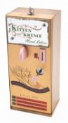 A mid 20th Century 'Kitten Kreme' lotion dispenser.