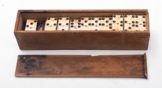 A late 19th/early 20th century set of bone and ebony 'Double 9' dominoes, unsigned,