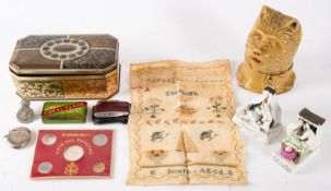 A small group of collectables, comprising a silver plated football vesta case, a needlework sampler,