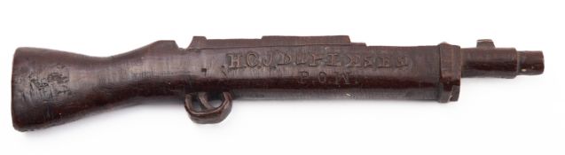 A WWI POW treen model of a carbine, inscribed 'H.C.J. Dupleses P.O.W.