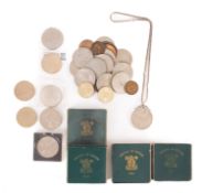 A collection of coins, including four 1951 Festival of Britain Crowns, 1819 Crown,