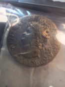 A collection of thirty two various Roman coins, each with written identifications,