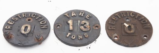 Three early 20th century cast iron wagon plates.