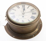 A 20th Century brass ship's bulkhead clock, maker H. Williamson, London.
