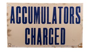 A metal 'Petroleum Spirit' warning sign.