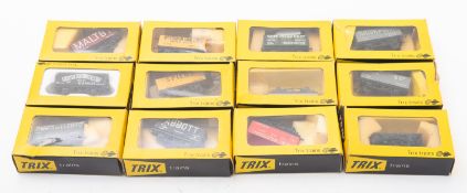 12 Trix Trains OO/HO ore wagons. In various liveries, all boxed.