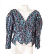 A group of seven vintage blouses and jackets.