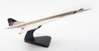 A 20th Century plastic model of Concorde. In white with red trim, on a stand, 59cm long.