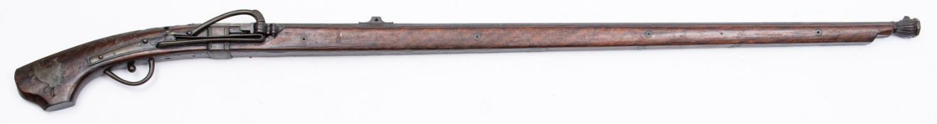 An Edo period Japanese tanegashima matchlock musket, the 39 1/2 inch barrel with silvered inlay,
