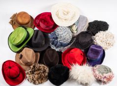 A large collection of lady's hats, including straw sun hats, felt hats, dress hats, etc.