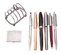 A silver toast rack and stamp box.