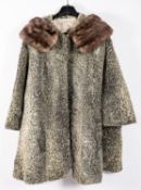 A group of fur coats, including a 'McEwens of Perth' grey fur coat and another similar,