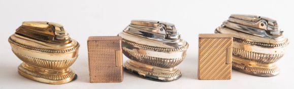 Two Dupont gold plated cigarette lighters.