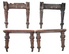 A set of mahogany trestle table legs.