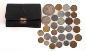 A small purse of coins containing 1933 2 1/2g, 1930 ten Francs, 1928 1/2 Gulder, etc.