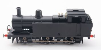 An O gauge 0-6-0 tank engine in black with red and gold trim, in associated box.