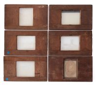 A collection of photographic magic lantern slides.