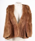 A group of three fur coats, including a dark brown 'Bobbys' waist length jacket with 'A.