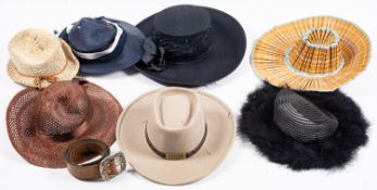 A group of various hats, including ladies dress hats, sun hats,