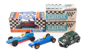 Six Tri-ang Scalextric cars.
