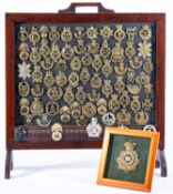 A brass Devonshire Regimental badge.