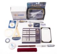 A collection of Concorde memorabilia, including two Corgi diecast models,