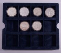 Five crown sized Chinese 999 silver crown sized coins.