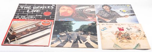 A collection of Beatles and Beatles related Vinyl records comprising seven LPs and eight 45 rpm