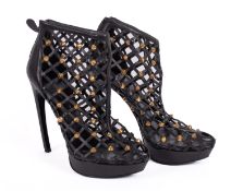 Alexander McQueen. A pair of Alexander McQueen black leather studded platform heels, size 39 1/2.