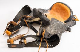 A black and brown leather Western style saddle, unsigned.