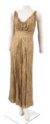 A collection of mid 20th century dresses, comprising a gold floral embroidered dress ,